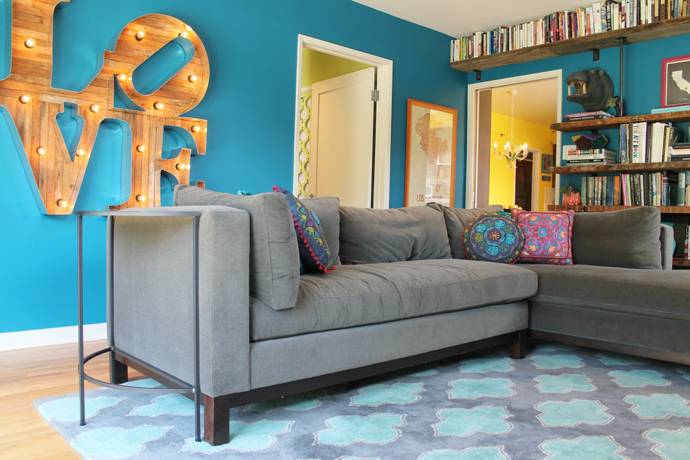 Living room - eclectic living room idea in Los Angeles with blue walls