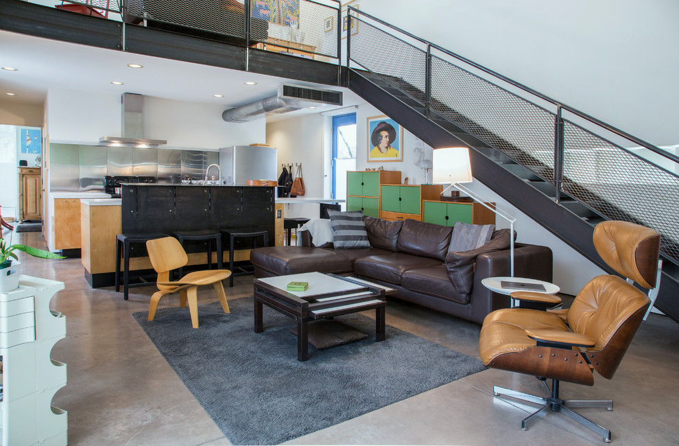 Inspiration for an industrial mezzanine living room in Other with white walls, concrete flooring and grey floors.