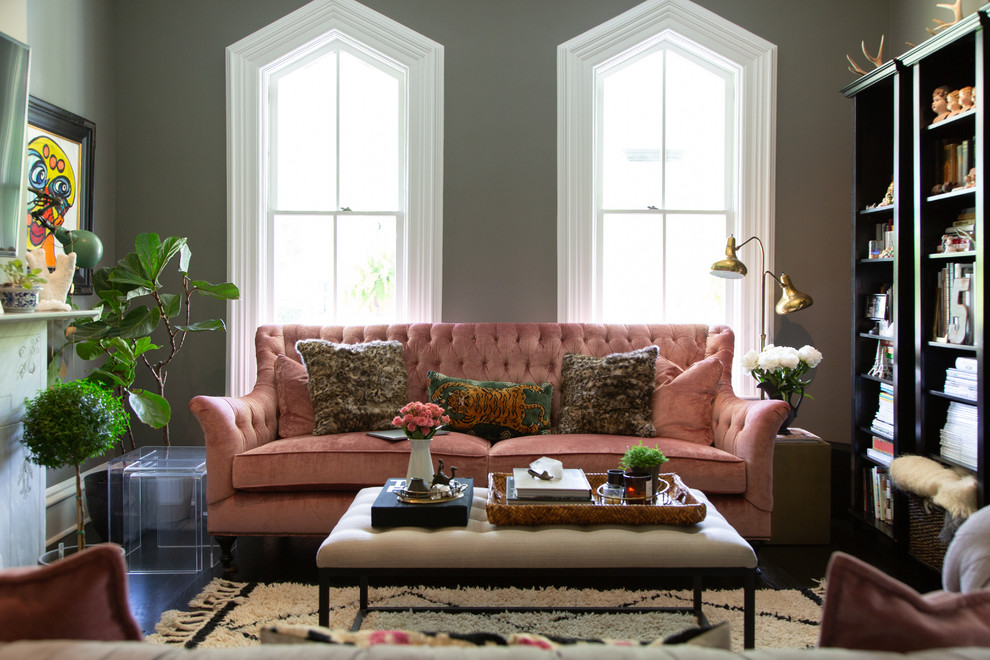 This is an example of a classic enclosed living room in Chicago with grey walls.