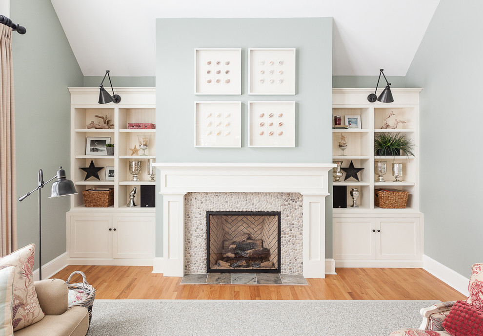 Living room - transitional medium tone wood floor living room idea in Other with a standard fireplace