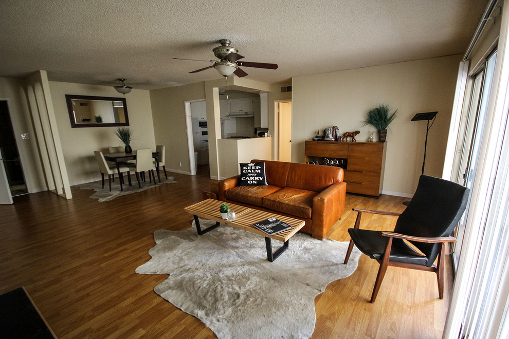 Small trendy open concept light wood floor living room photo in Los Angeles with beige walls