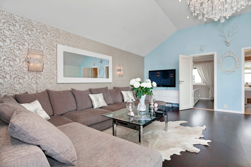 Inspiration pour un salon design avec un mur bleu et un téléviseur fixé au mur.