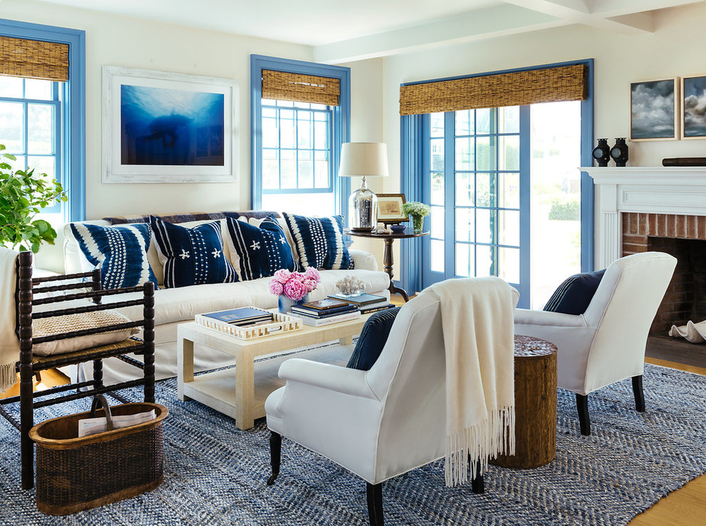 Living room - mid-sized coastal open concept and formal light wood floor living room idea in Providence with a standard fireplace, a brick fireplace and white walls