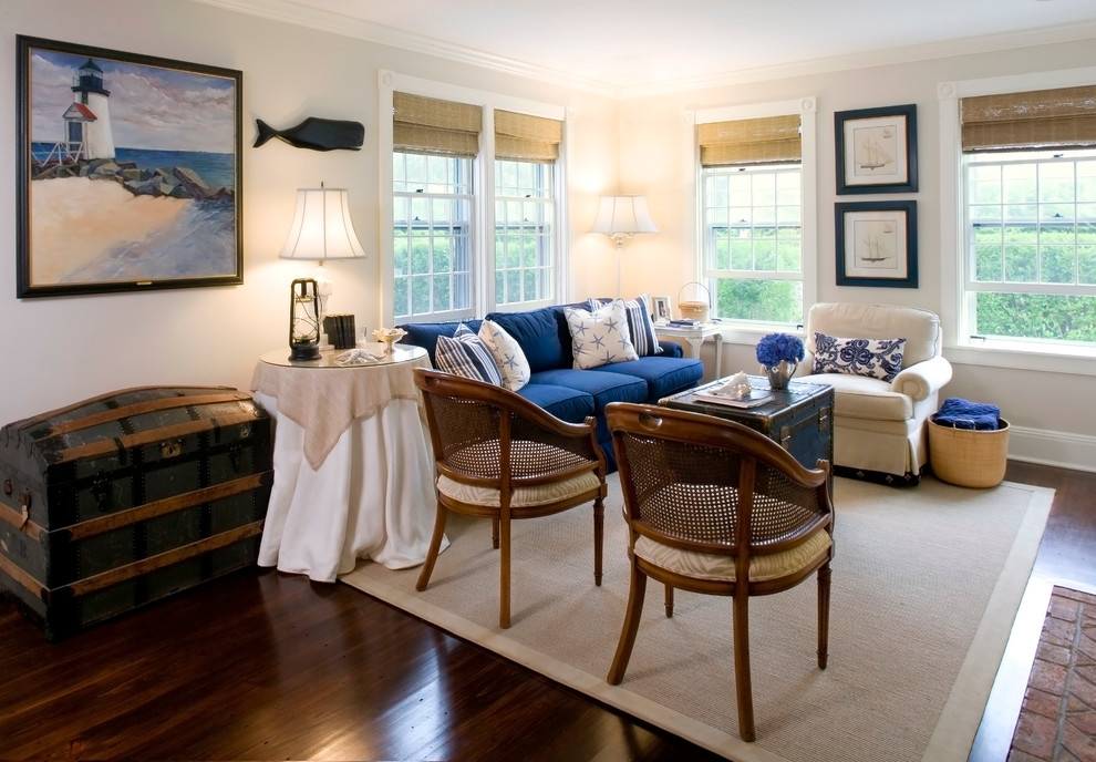 Traditional living room in Boston with beige walls, dark hardwood flooring and feature lighting.