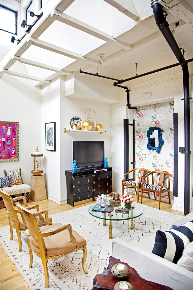 Inspiration for an eclectic light wood floor living room remodel in Philadelphia with white walls and a tv stand