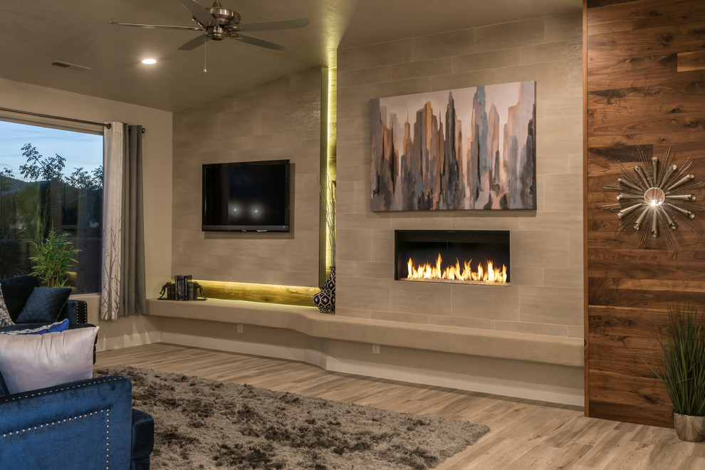 Living room - mid-sized contemporary formal and open concept porcelain tile and brown floor living room idea in Other with beige walls, a ribbon fireplace, a tile fireplace and a media wall