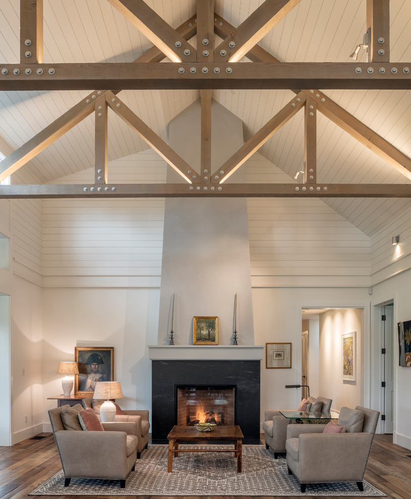 Inspiration for a farmhouse dark wood floor and brown floor living room remodel in San Francisco with white walls and a standard fireplace