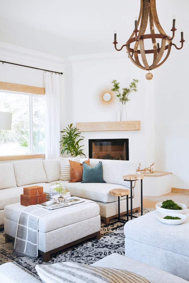 Living room - large mediterranean open concept slate floor and brown floor living room idea in Phoenix with white walls, a corner fireplace and a plaster fireplace