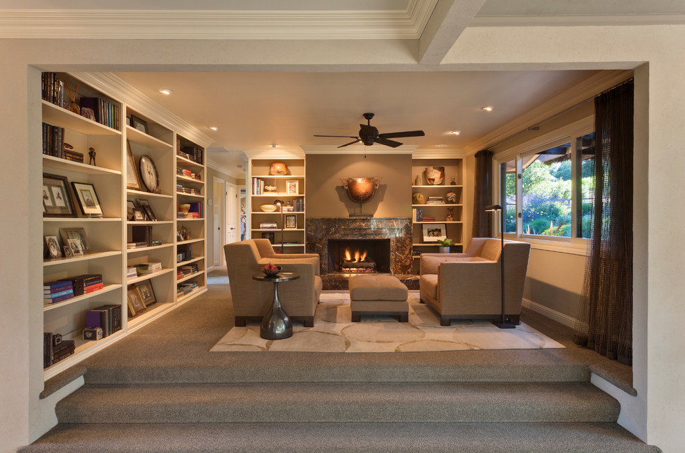 This is an example of a contemporary open plan living room in San Francisco with a reading nook, grey walls, carpet, a standard fireplace and a stone fireplace surround.