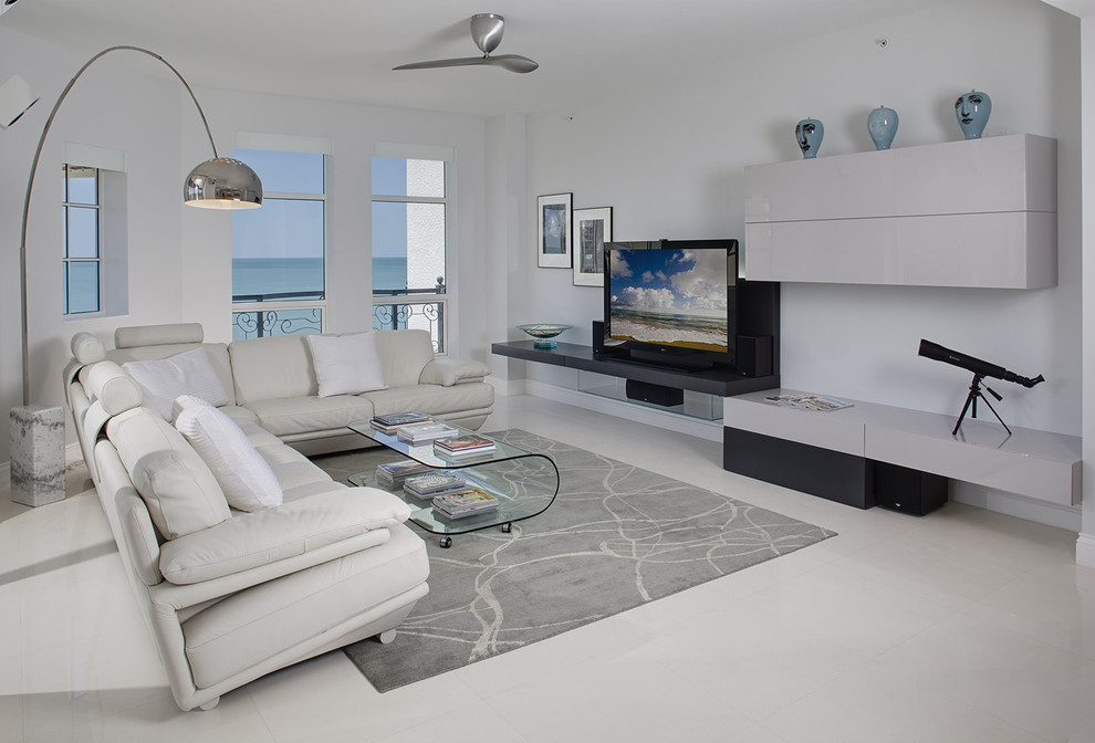 Inspiration for a contemporary living room in Miami with white walls and feature lighting.