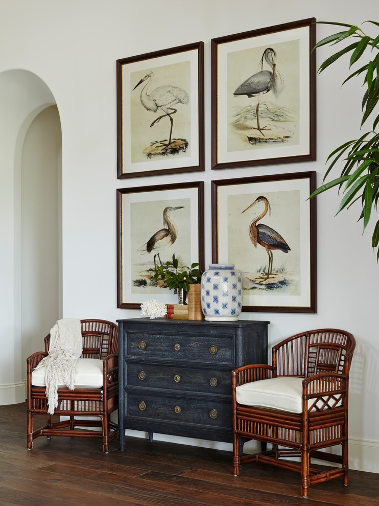 Inspiration for a huge tropical open concept medium tone wood floor living room remodel in Miami with white walls and no tv