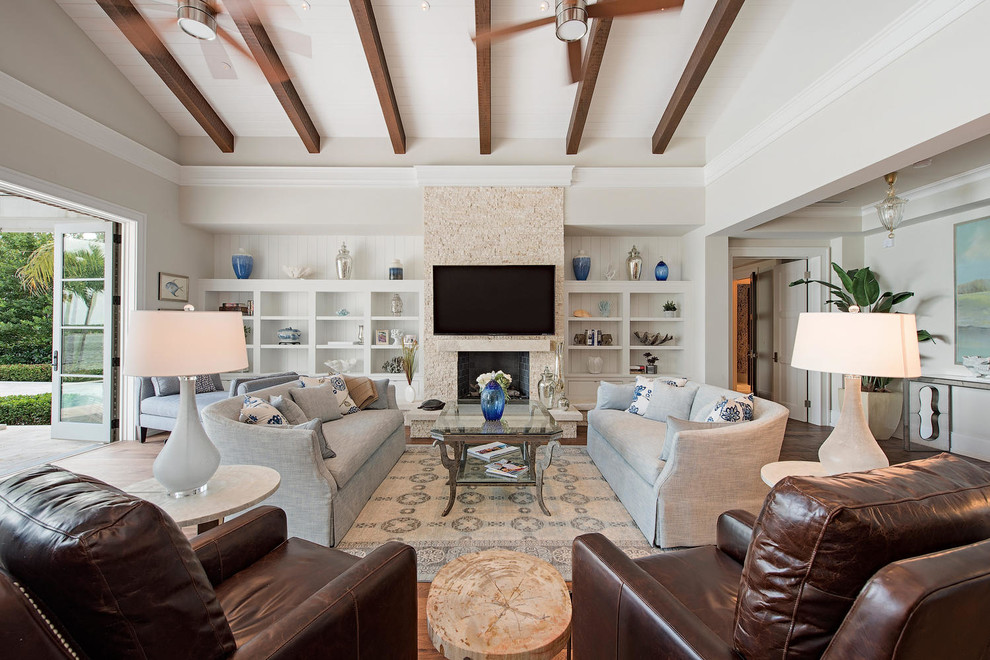 Living room - large coastal formal and open concept medium tone wood floor living room idea in Miami with white walls, a standard fireplace, a tile fireplace and a wall-mounted tv