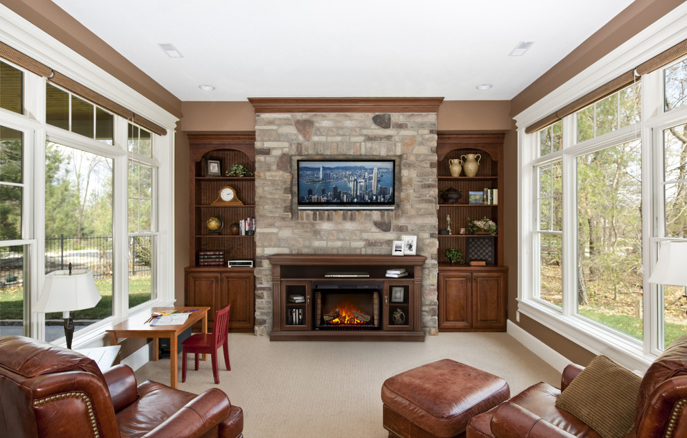 Example of a mid-sized classic enclosed carpeted and beige floor living room design in Other with brown walls, a standard fireplace, a wood fireplace surround and a wall-mounted tv