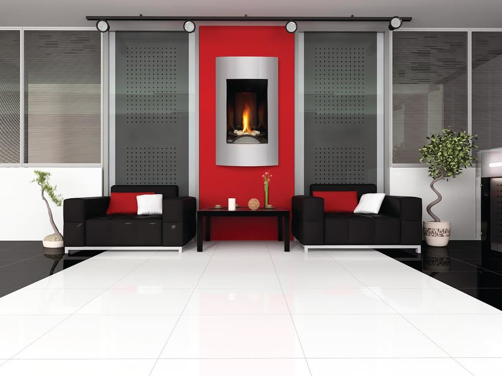 Cette image montre un grand salon design fermé avec une salle de réception, un mur rouge, une cheminée standard, un manteau de cheminée en pierre et aucun téléviseur.