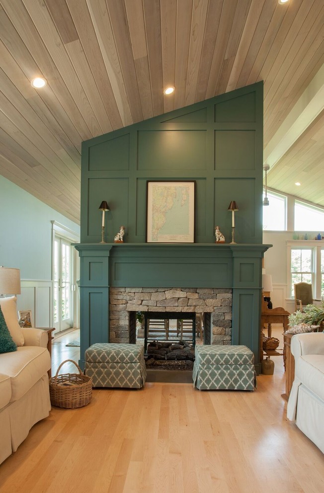Inspiration for a mid-sized coastal open concept light wood floor living room remodel in Providence with blue walls, a two-sided fireplace, a stone fireplace and a wall-mounted tv