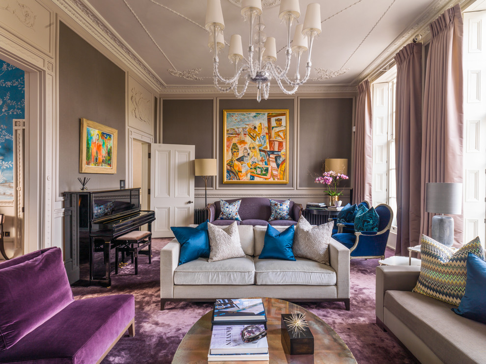 На фото: большая парадная, открытая гостиная комната в классическом стиле с коричневыми стенами, ковровым покрытием и фиолетовым полом без телевизора