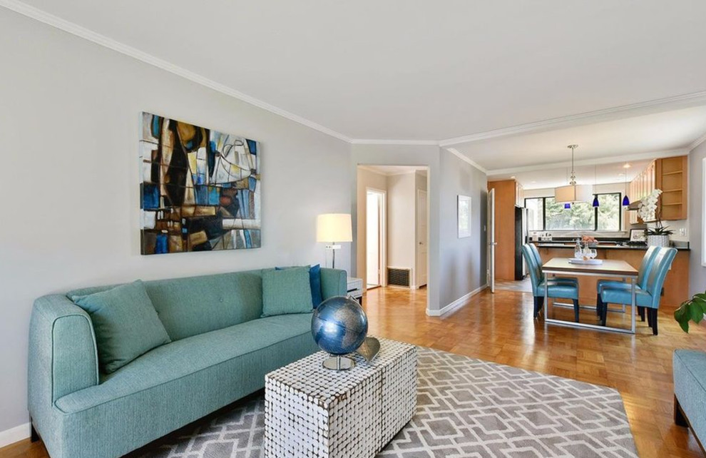 Photo of a medium sized contemporary formal and grey and teal open plan living room in Boston with grey walls, light hardwood flooring, no fireplace and no tv.