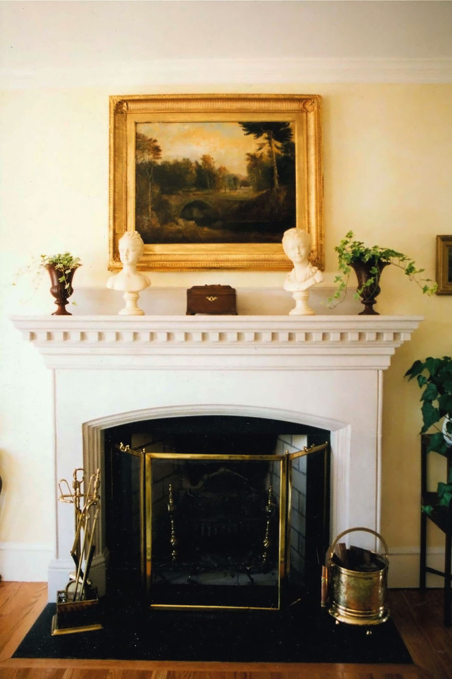 Inspiration for a large classic formal open plan living room in Boston with yellow walls, medium hardwood flooring, a standard fireplace, a stone fireplace surround and brown floors.