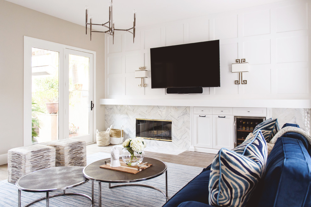 Living room - 1960s enclosed light wood floor living room idea in San Diego with beige walls, a standard fireplace, a stone fireplace and a wall-mounted tv