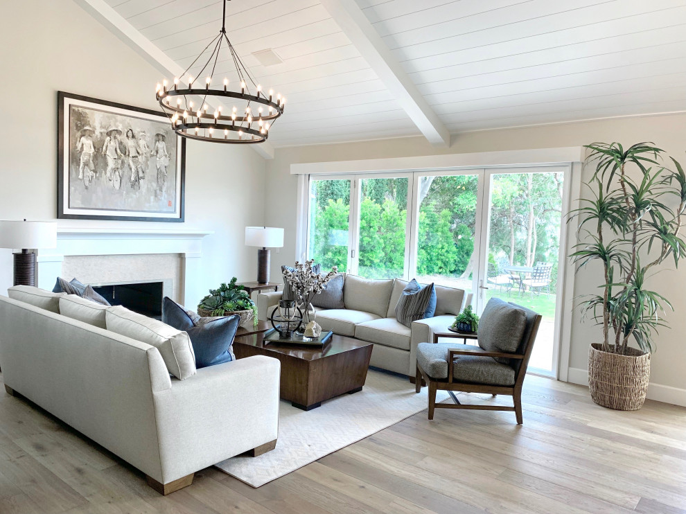 Design ideas for a large farmhouse open plan living room in Orange County with beige walls, medium hardwood flooring, a standard fireplace, a stone fireplace surround, beige floors and a timber clad ceiling.