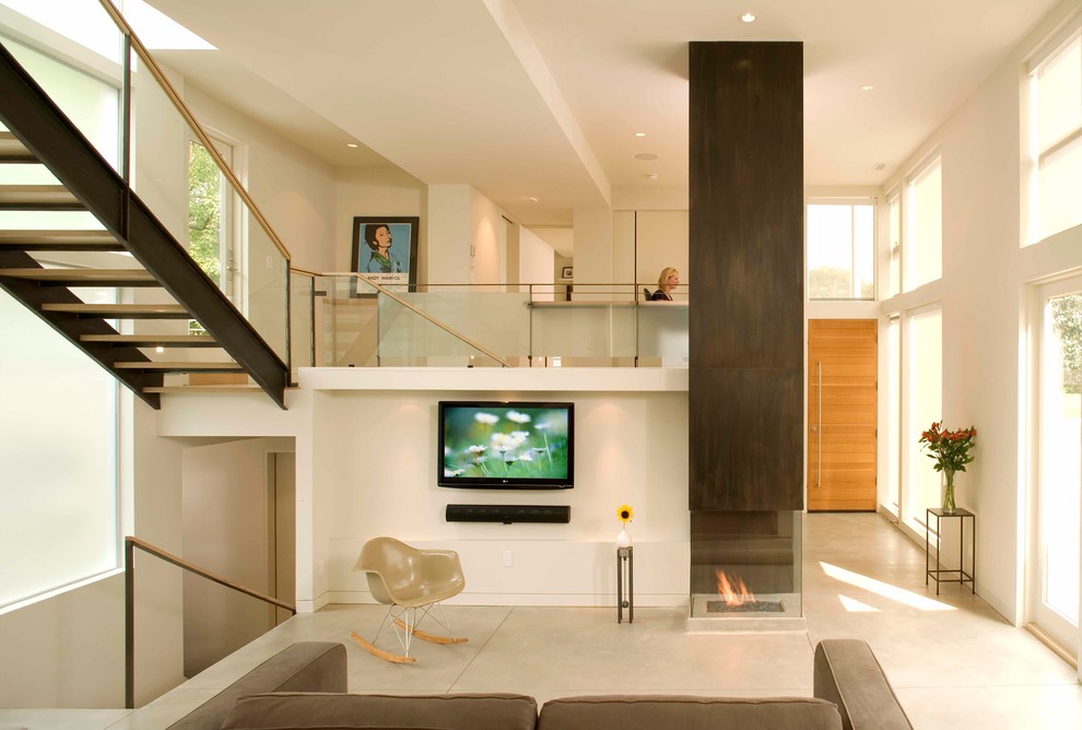 Inspiration for a contemporary living room in Denver with white walls, a standard fireplace and a wall mounted tv.
