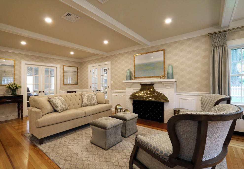 Inspiration for a large traditional formal enclosed living room in Boston with beige walls, light hardwood flooring, a standard fireplace, a brick fireplace surround and no tv.