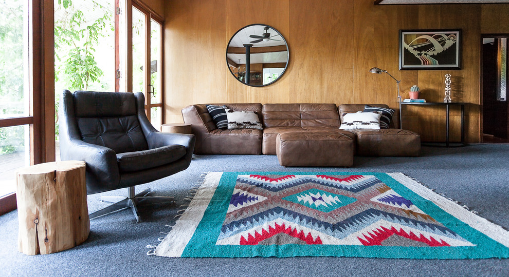 Mid-century modern formal carpeted living room photo in Sacramento with brown walls, no fireplace and no tv