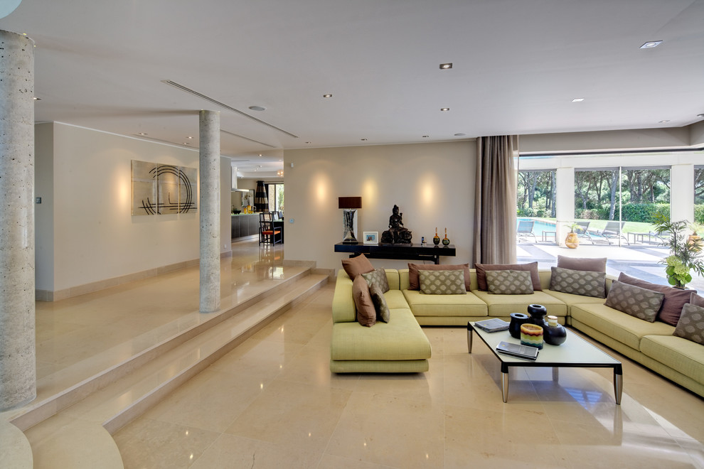 Large contemporary open plan living room in Other with grey walls and marble flooring.