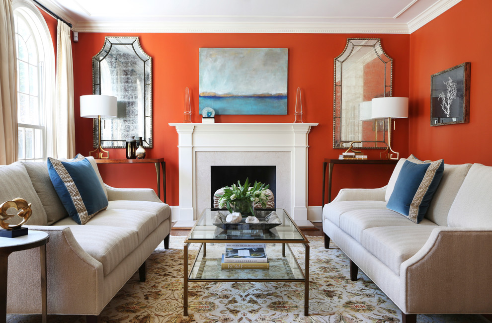 Example of a mid-sized classic formal and enclosed carpeted and multicolored floor living room design in New York with a standard fireplace, red walls, a stone fireplace and no tv