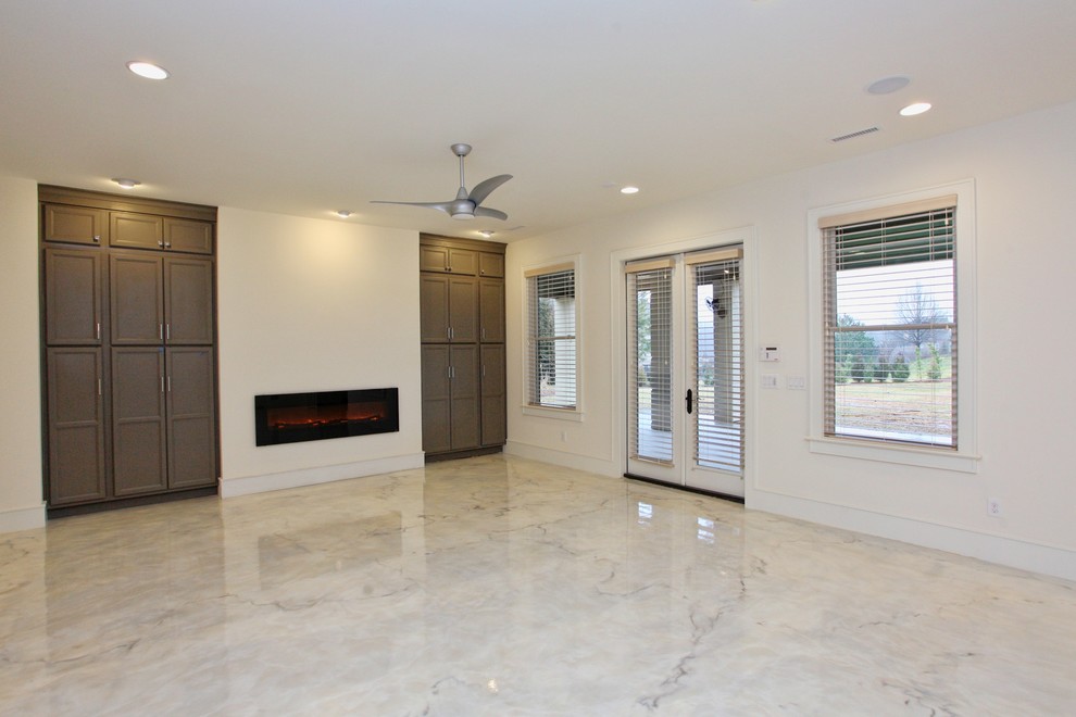 This is an example of a large contemporary formal enclosed living room in Raleigh with white walls, marble flooring, no tv, a hanging fireplace and white floors.