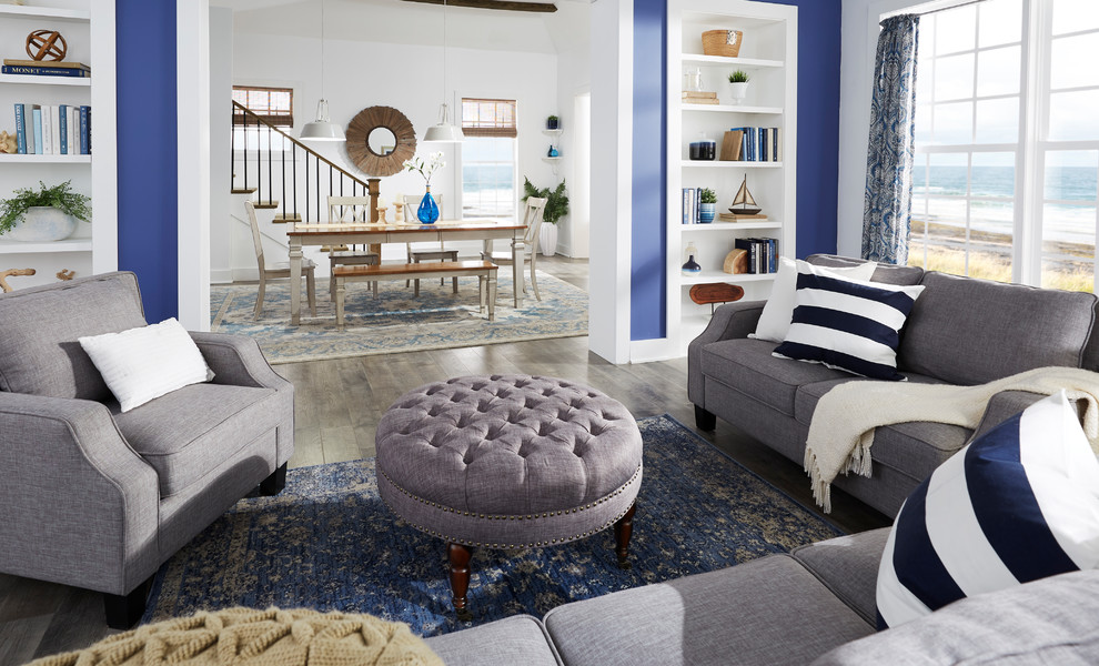 Foto di un soggiorno stile marino di medie dimensioni con parquet chiaro, nessun camino, nessuna TV, pavimento grigio, sala formale e pareti blu