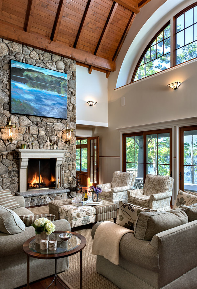 Inspiration for a huge timeless formal and open concept dark wood floor and brown floor living room remodel in Boston with gray walls, a standard fireplace, a stone fireplace and no tv