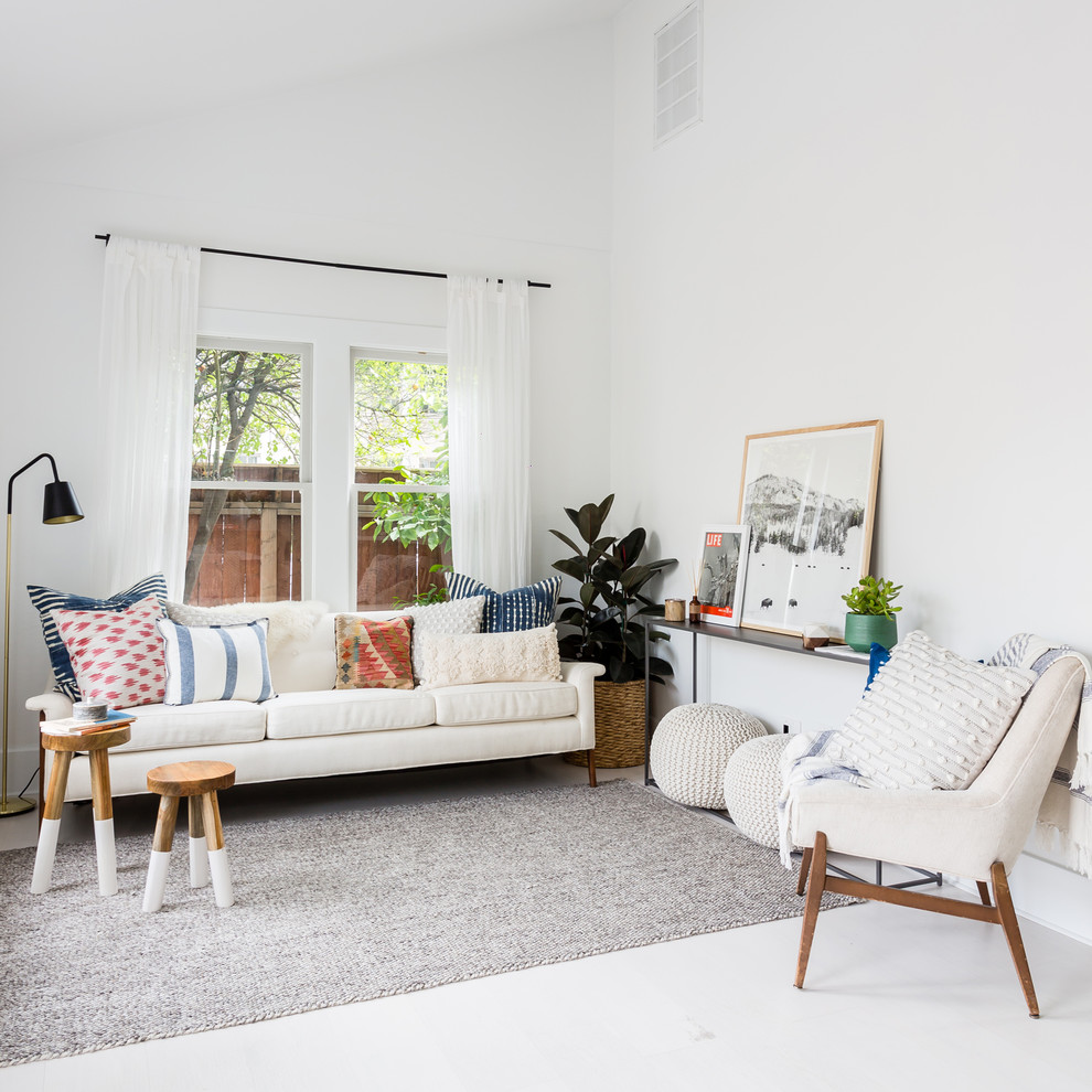 Scandi living room in Other with white walls and white floors.