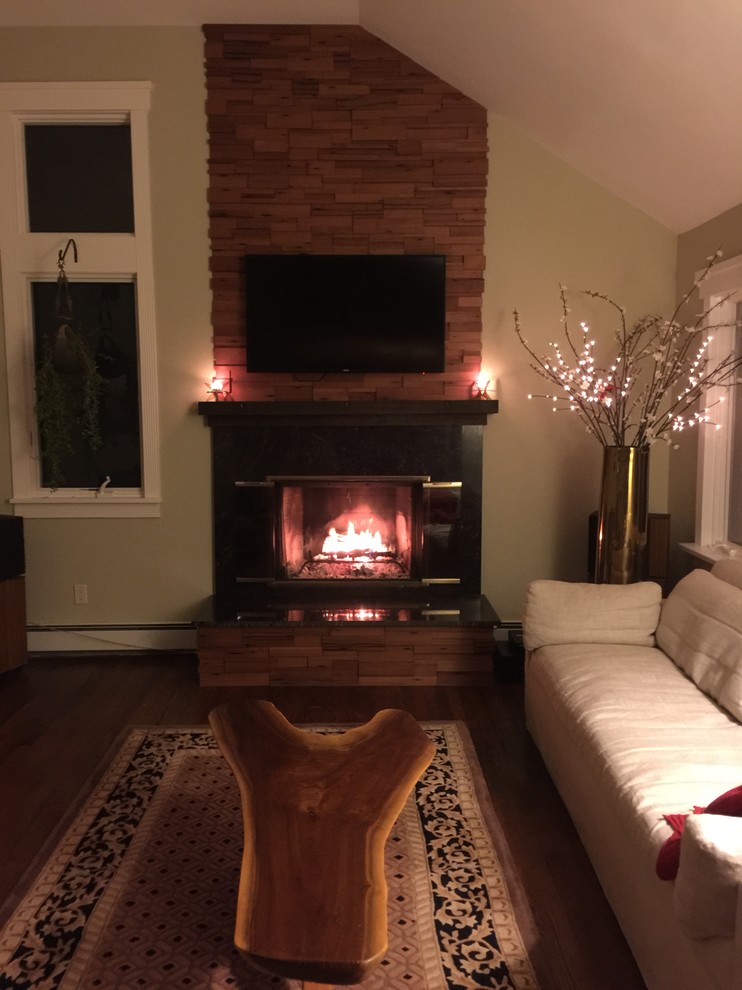 Mid-sized mountain style formal and open concept living room photo in New York with a standard fireplace, a wood fireplace surround and a wall-mounted tv