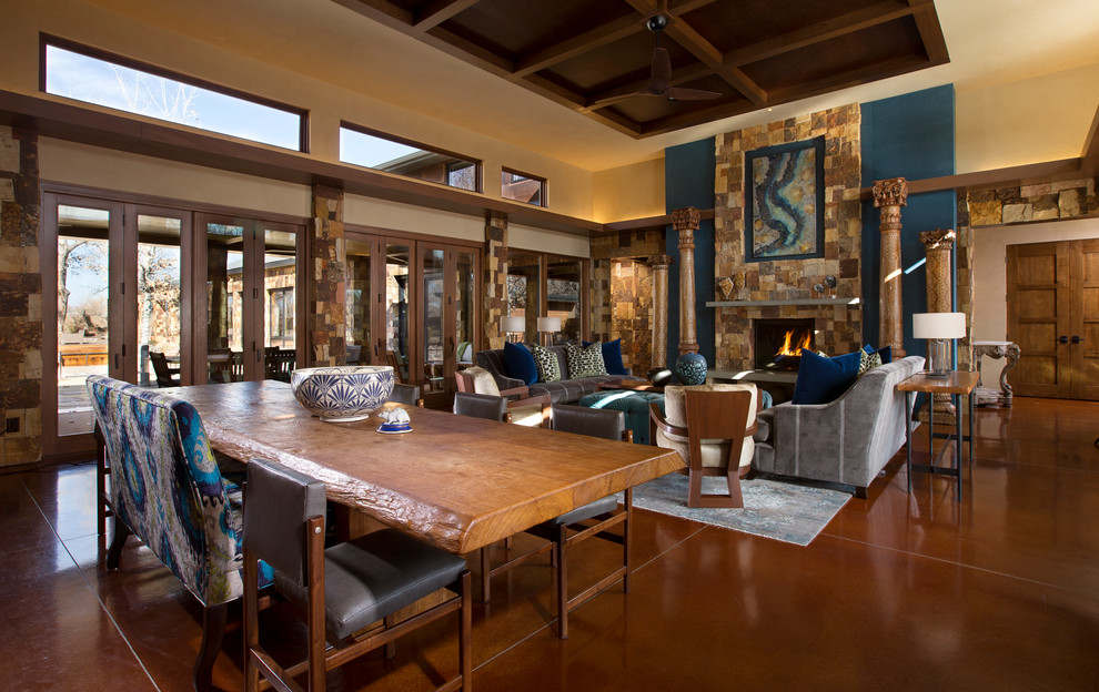 Design ideas for a large classic open plan living room in Albuquerque with blue walls, concrete flooring, a standard fireplace, a stone fireplace surround and no tv.