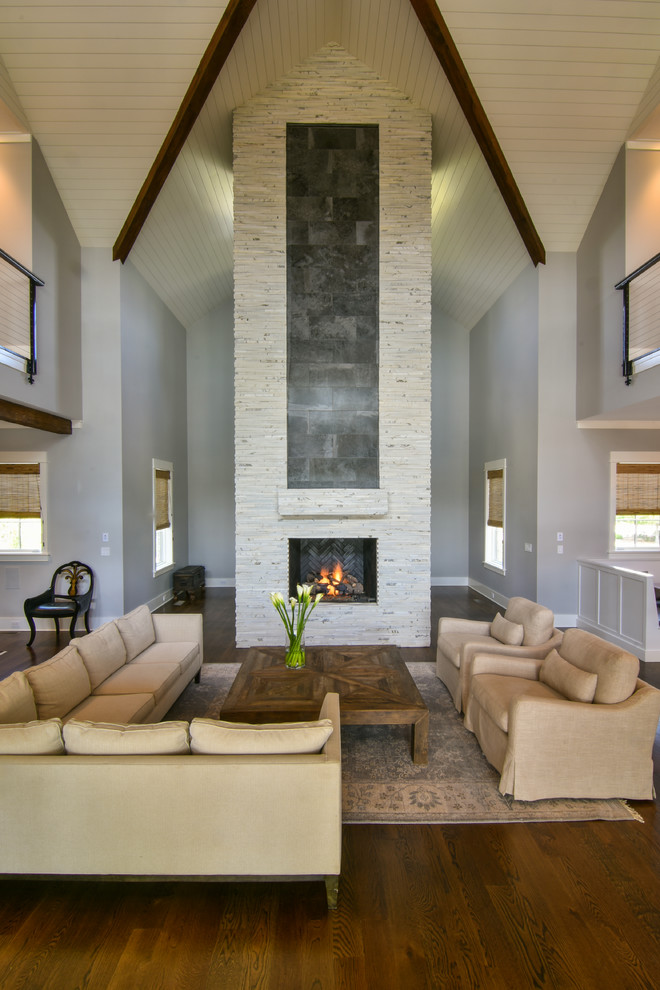 Large transitional open concept and formal dark wood floor and brown floor living room photo in Charleston with a standard fireplace, a stone fireplace and gray walls