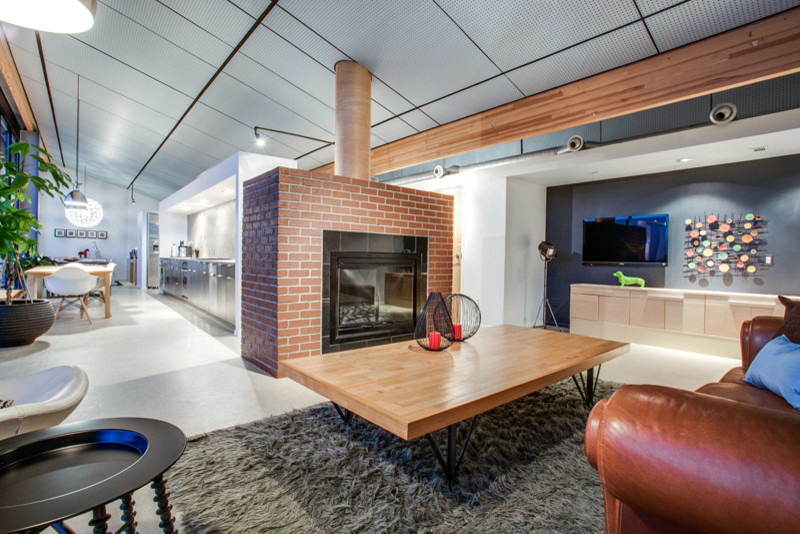 Example of a large urban formal and open concept linoleum floor living room design in Dallas with multicolored walls, a wood stove, a brick fireplace and a wall-mounted tv