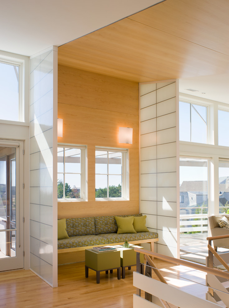 Design ideas for a coastal open plan living room in Boston with medium hardwood flooring.