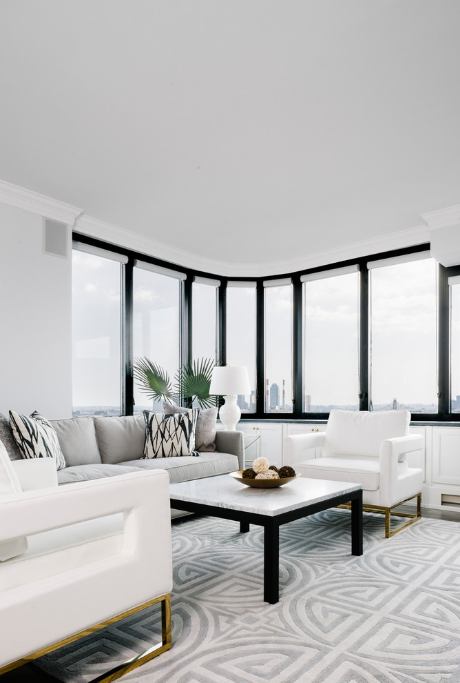 Foto di un soggiorno design con pavimento grigio, sala formale e pareti bianche