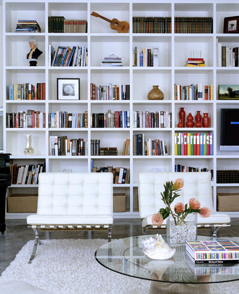 Mid-sized minimalist open concept concrete floor and gray floor living room library photo in Los Angeles with white walls, a standard fireplace, a tile fireplace and no tv