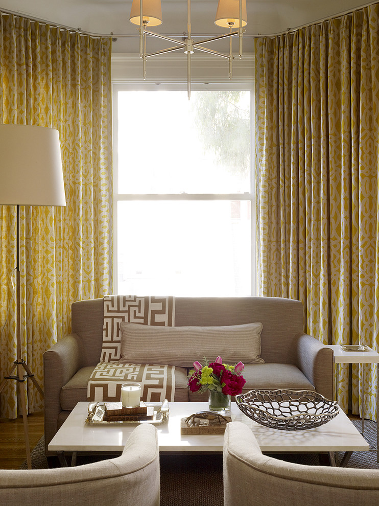 This is an example of a classic living room curtain in San Francisco with dark hardwood flooring.