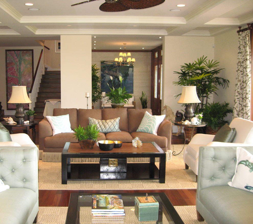 Living room - large tropical dark wood floor living room idea in Orange County with beige walls and no fireplace