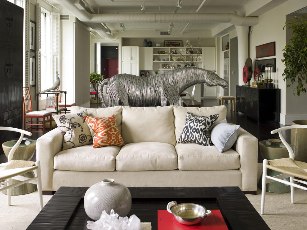Eclectic open concept living room photo in New York with white walls