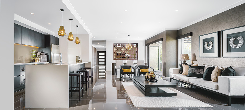Пример оригинального дизайна: открытая гостиная комната в современном стиле с серыми стенами без камина, телевизора