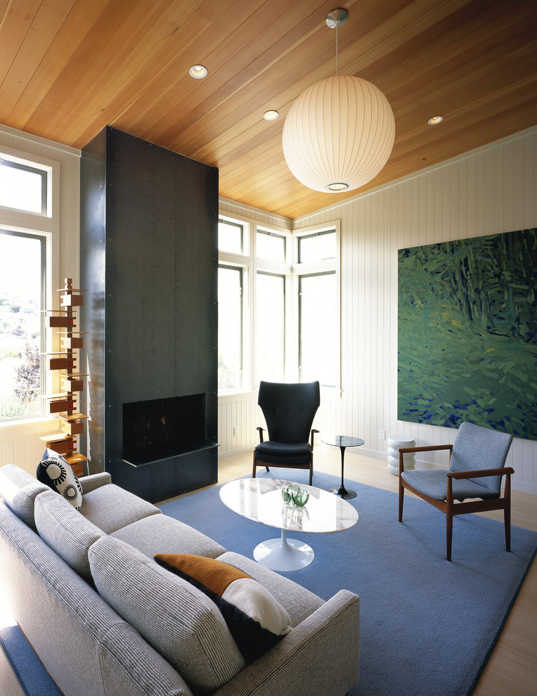 Immagine di un soggiorno minimalista di medie dimensioni con pareti bianche
