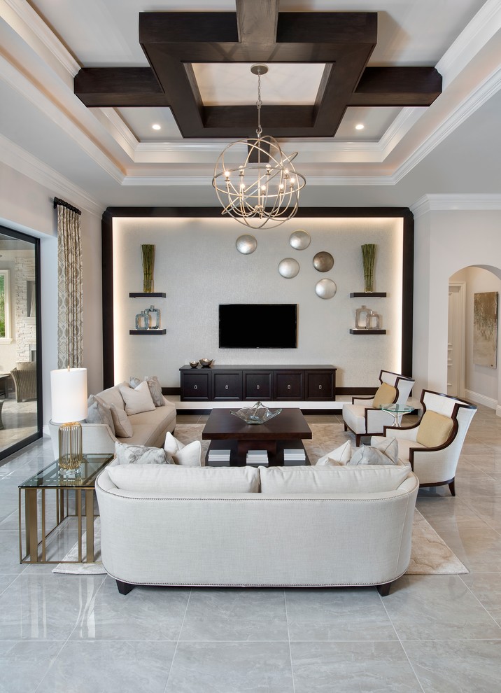 Example of a mid-sized transitional formal and open concept limestone floor and white floor living room design in Miami with beige walls, no fireplace and a wall-mounted tv