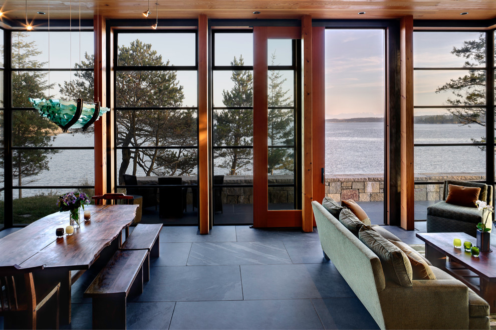 Medium sized modern open plan living room in Seattle with slate flooring.