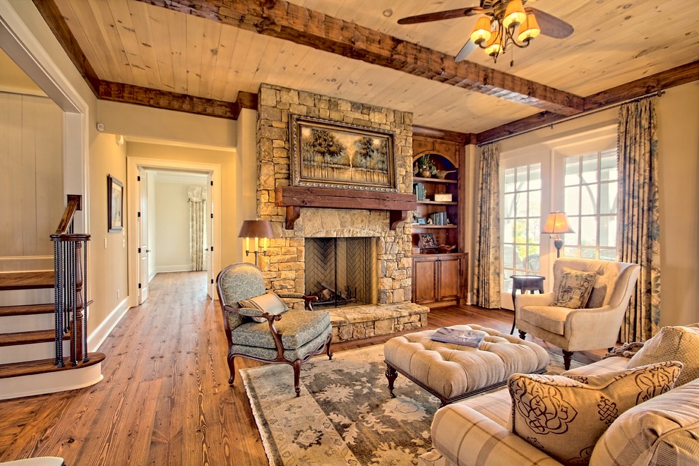 Design ideas for a medium sized rustic formal open plan living room in Atlanta with beige walls, light hardwood flooring, a standard fireplace, a stone fireplace surround and no tv.