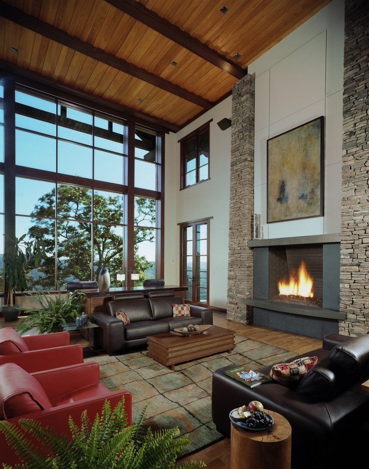 Example of a large minimalist formal and open concept medium tone wood floor and brown floor living room design in Other with white walls, a stone fireplace, a standard fireplace and no tv