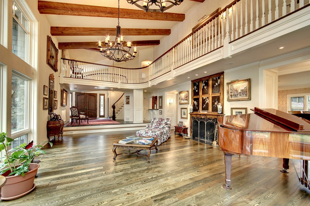 Ejemplo de salón para visitas abierto clásico grande sin televisor con paredes blancas, suelo de madera en tonos medios y todas las chimeneas
